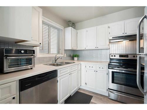 102-1516 11 Avenue Sw, Calgary, AB - Indoor Photo Showing Kitchen With Stainless Steel Kitchen With Double Sink