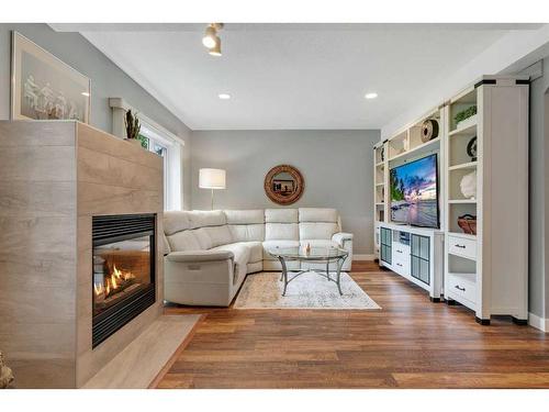 358 Mountain Park Drive Se, Calgary, AB - Indoor Photo Showing Living Room With Fireplace