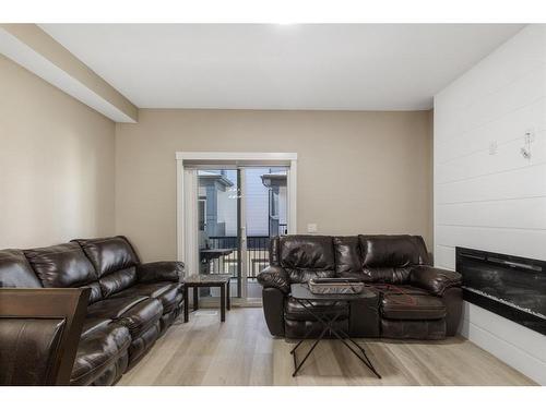 406-95 Skyview Close Ne, Calgary, AB - Indoor Photo Showing Living Room With Fireplace