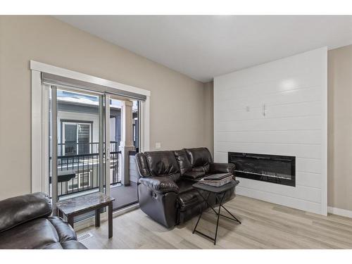 406-95 Skyview Close Ne, Calgary, AB - Indoor Photo Showing Living Room With Fireplace