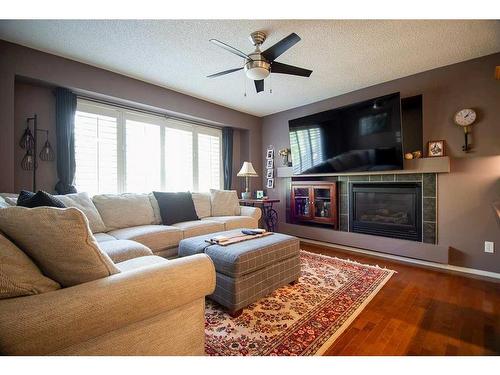 52 Everglen Way Sw, Calgary, AB - Indoor Photo Showing Living Room With Fireplace