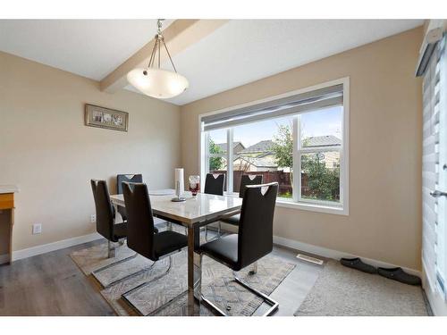 42 Martha'S Close Ne, Calgary, AB - Indoor Photo Showing Dining Room With Fireplace