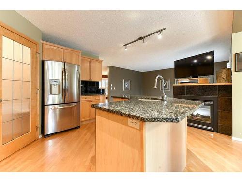 55 Bridlepost Green Sw, Calgary, AB - Indoor Photo Showing Kitchen With Stainless Steel Kitchen