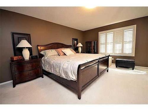 55 Bridlepost Green Sw, Calgary, AB - Indoor Photo Showing Bedroom