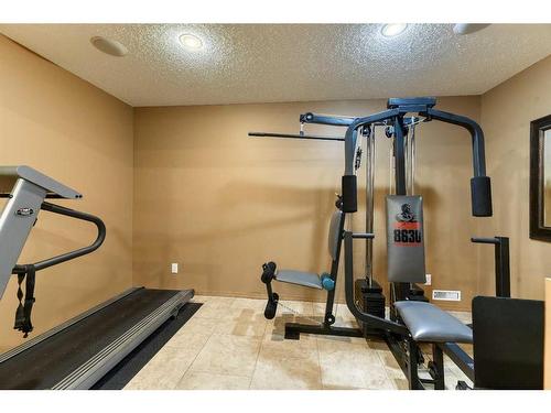 55 Bridlepost Green Sw, Calgary, AB - Indoor Photo Showing Gym Room