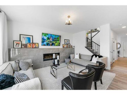 171 Red Sky Crescent Ne, Calgary, AB - Indoor Photo Showing Living Room With Fireplace