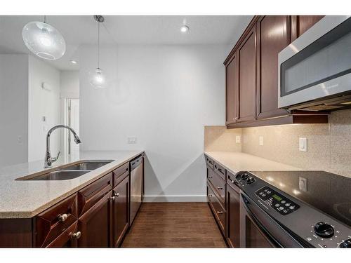 3-1940 24A Street Sw, Calgary, AB - Indoor Photo Showing Kitchen With Double Sink With Upgraded Kitchen