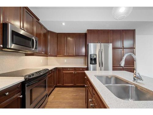 3-1940 24A Street Sw, Calgary, AB - Indoor Photo Showing Kitchen With Double Sink