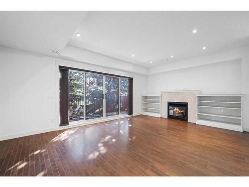 3-1940 24A Street Sw, Calgary, AB - Indoor Photo Showing Living Room With Fireplace