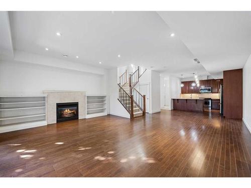 3-1940 24A Street Sw, Calgary, AB - Indoor Photo Showing Living Room With Fireplace