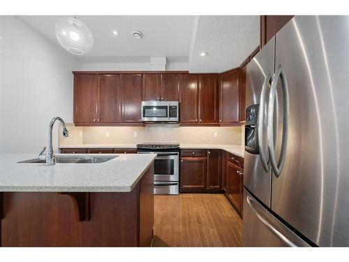 3-1940 24A Street Sw, Calgary, AB - Indoor Photo Showing Kitchen With Double Sink With Upgraded Kitchen