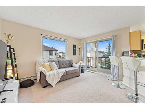 1202-16969 24 Street Sw, Calgary, AB - Indoor Photo Showing Living Room