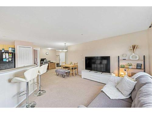 1202-16969 24 Street Sw, Calgary, AB - Indoor Photo Showing Living Room