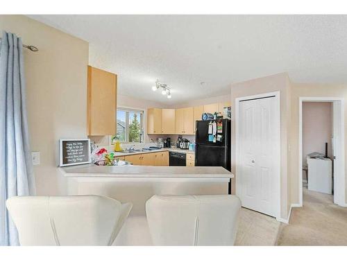 1202-16969 24 Street Sw, Calgary, AB - Indoor Photo Showing Kitchen With Double Sink