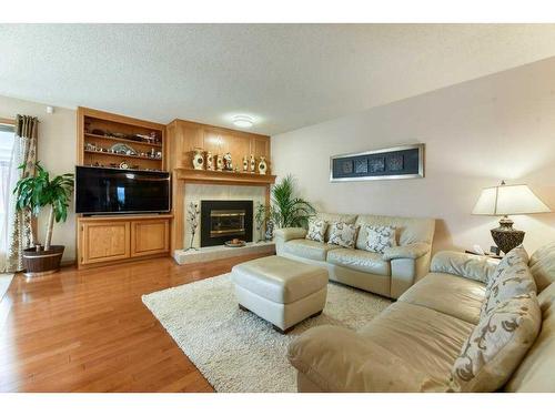 86 Hawkdale Circle Nw, Calgary, AB - Indoor Photo Showing Living Room With Fireplace