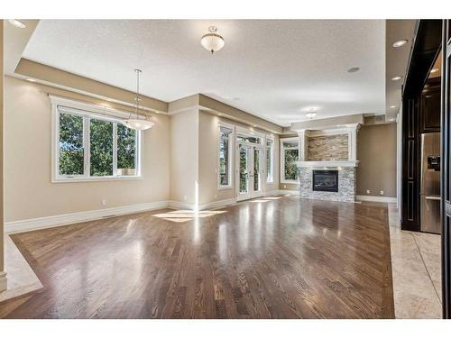 5220 Montalban Avenue Nw, Calgary, AB - Indoor Photo Showing Living Room With Fireplace