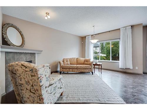 20 Brightondale Green Se, Calgary, AB - Indoor Photo Showing Living Room With Fireplace