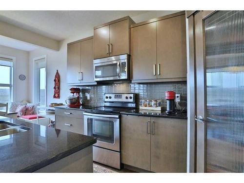 324 Evansborough Way Nw, Calgary, AB - Indoor Photo Showing Kitchen With Stainless Steel Kitchen With Double Sink With Upgraded Kitchen