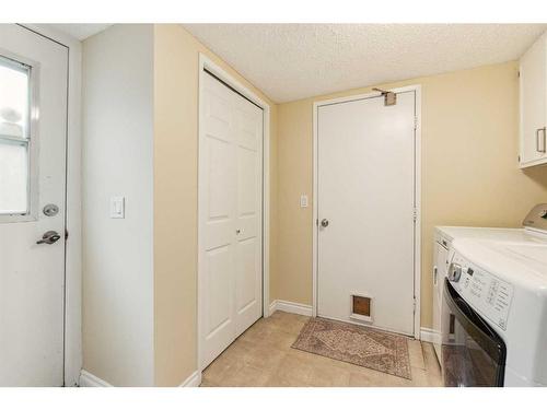 119 Oakside Place Sw, Calgary, AB - Indoor Photo Showing Laundry Room