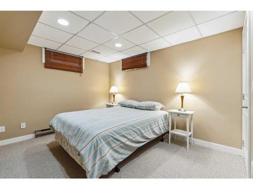 119 Oakside Place Sw, Calgary, AB - Indoor Photo Showing Bedroom