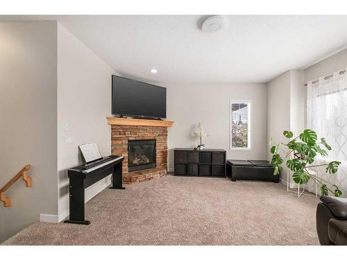 189 Cranfield Manor Se, Calgary, AB - Indoor With Fireplace