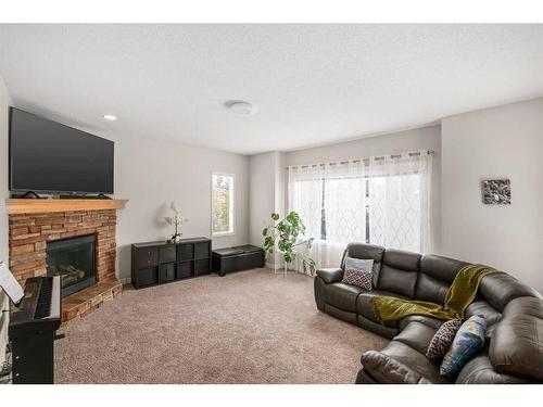 189 Cranfield Manor Se, Calgary, AB - Indoor Photo Showing Living Room With Fireplace