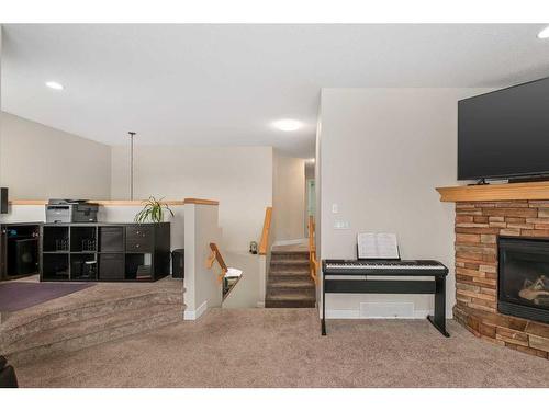 189 Cranfield Manor Se, Calgary, AB - Indoor With Fireplace