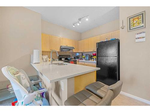 2212-1140 Taradale Drive Ne, Calgary, AB - Indoor Photo Showing Kitchen With Double Sink