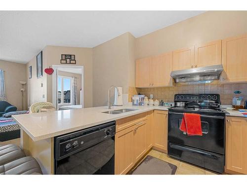 2212-1140 Taradale Drive Ne, Calgary, AB - Indoor Photo Showing Kitchen With Double Sink