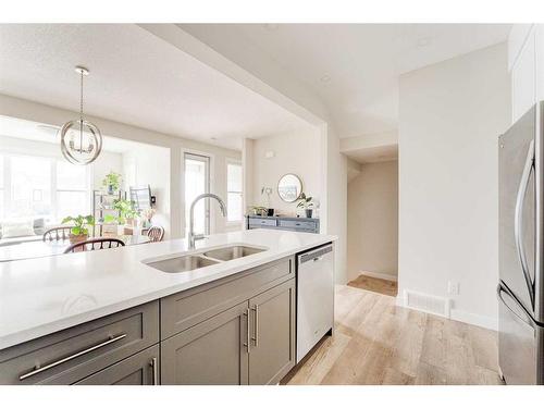 107 Crestridge Common Sw, Calgary, AB - Indoor Photo Showing Kitchen With Double Sink