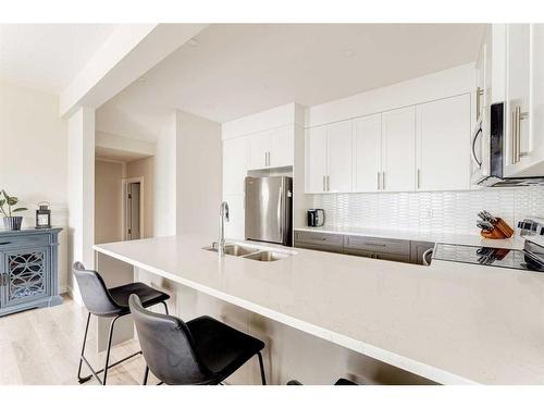 107 Crestridge Common Sw, Calgary, AB - Indoor Photo Showing Kitchen With Double Sink With Upgraded Kitchen