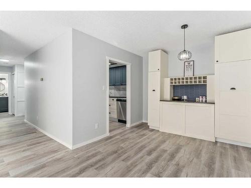 207-3730 50 Street Nw, Calgary, AB - Indoor Photo Showing Living Room With Fireplace