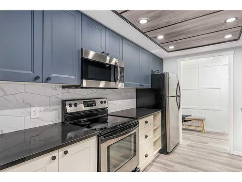 207-3730 50 Street Nw, Calgary, AB - Indoor Photo Showing Kitchen With Stainless Steel Kitchen