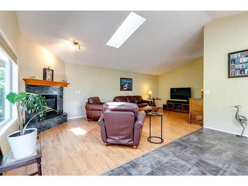 186 West Lakeview Passage, Chestermere, AB - Indoor Photo Showing Living Room With Fireplace