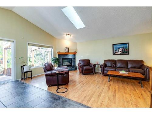 186 West Lakeview Passage, Chestermere, AB - Indoor Photo Showing Living Room With Fireplace