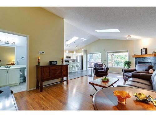 186 West Lakeview Passage, Chestermere, AB - Indoor Photo Showing Living Room With Fireplace