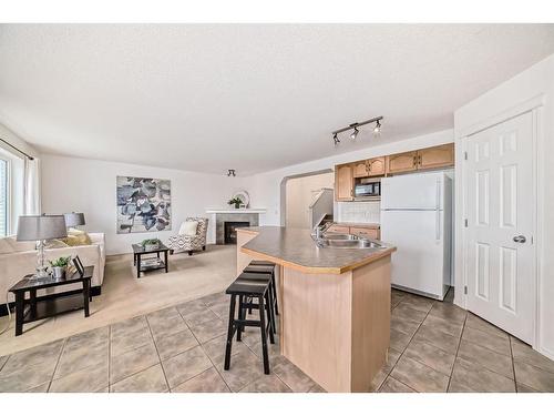 234 Panamount Hill Nw, Calgary, AB - Indoor Photo Showing Kitchen With Double Sink