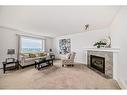 234 Panamount Hill Nw, Calgary, AB  - Indoor Photo Showing Living Room With Fireplace 