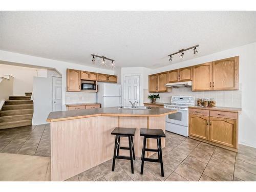 234 Panamount Hill Nw, Calgary, AB - Indoor Photo Showing Kitchen With Double Sink