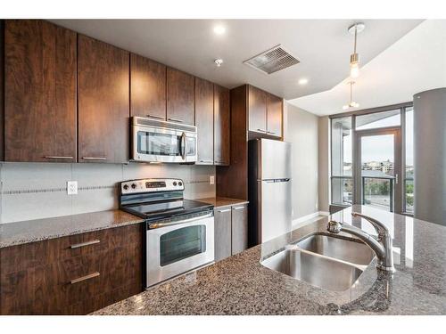 501-220 12 Avenue Se, Calgary, AB - Indoor Photo Showing Kitchen With Stainless Steel Kitchen With Double Sink