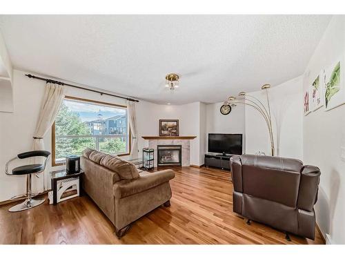 142 Harvest Creek Close Ne, Calgary, AB - Indoor Photo Showing Living Room With Fireplace