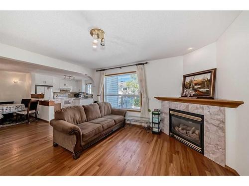 142 Harvest Creek Close Ne, Calgary, AB - Indoor Photo Showing Living Room With Fireplace