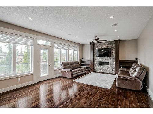 95 Panatella View Nw, Calgary, AB - Indoor Photo Showing Living Room With Fireplace