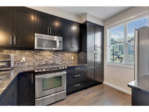 11 Nolan Hill Boulevard Nw, Calgary, AB - Indoor Photo Showing Kitchen With Upgraded Kitchen