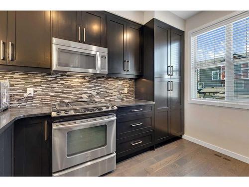 11 Nolan Hill Boulevard Nw, Calgary, AB - Indoor Photo Showing Kitchen With Upgraded Kitchen