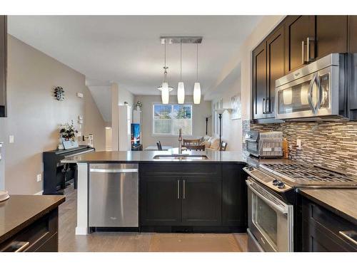 11 Nolan Hill Boulevard Nw, Calgary, AB - Indoor Photo Showing Kitchen With Upgraded Kitchen