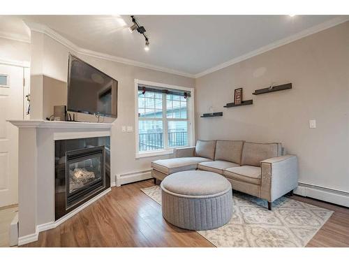 227-112 14 Avenue Se, Calgary, AB - Indoor Photo Showing Living Room With Fireplace