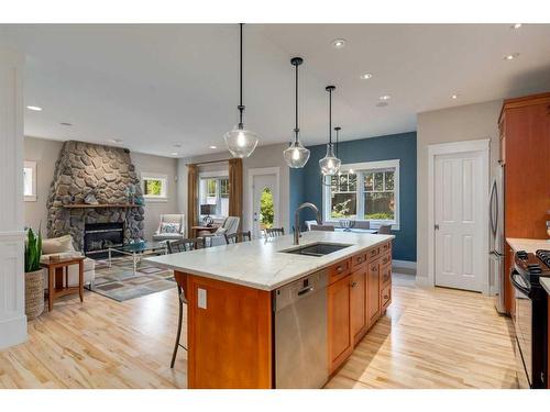 2022 7 Avenue Nw, Calgary, AB - Indoor Photo Showing Kitchen With Fireplace With Double Sink