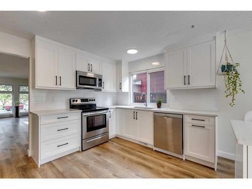 127 Midglen Place Se, Calgary, AB - Indoor Photo Showing Kitchen With Upgraded Kitchen