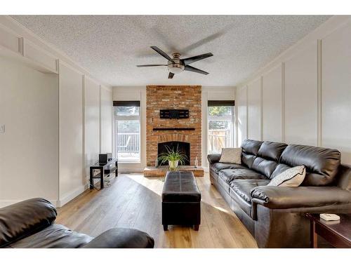 127 Midglen Place Se, Calgary, AB - Indoor Photo Showing Living Room With Fireplace